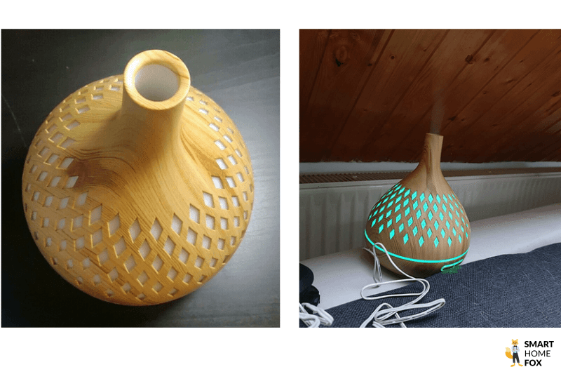 Der ASAKUKI Premium Aroma Diffuser steht auf einem Tisch und die LED-Beleuchtung leuchtet blau